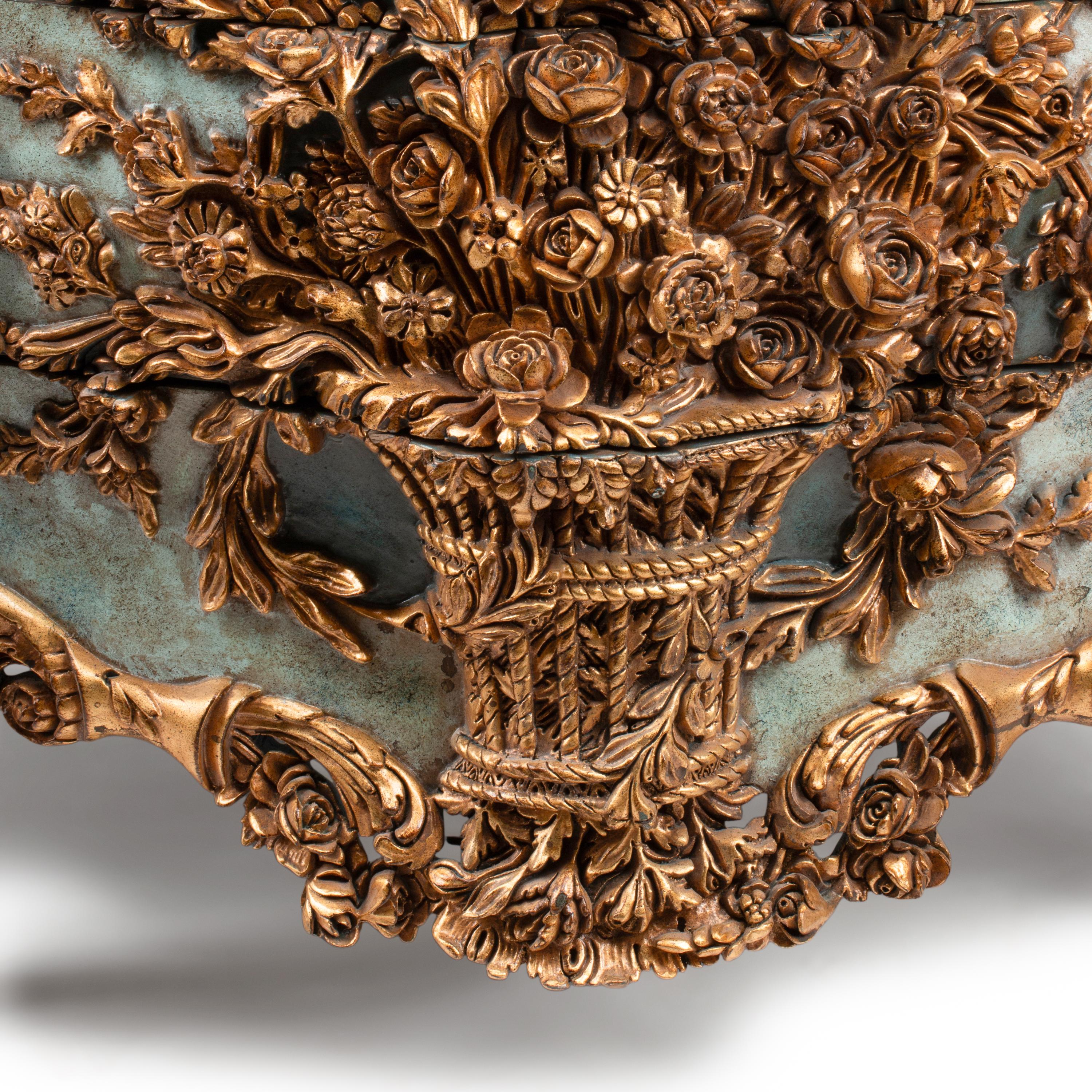 An Italian Carved, Painted and Parcel Gilt Commode