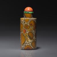 A Chinese Puddingstone Snuff Bottle, Qing Dynasty, Circa 1760-1880 — 1760-1880年 抱子石素面鼻煙壺