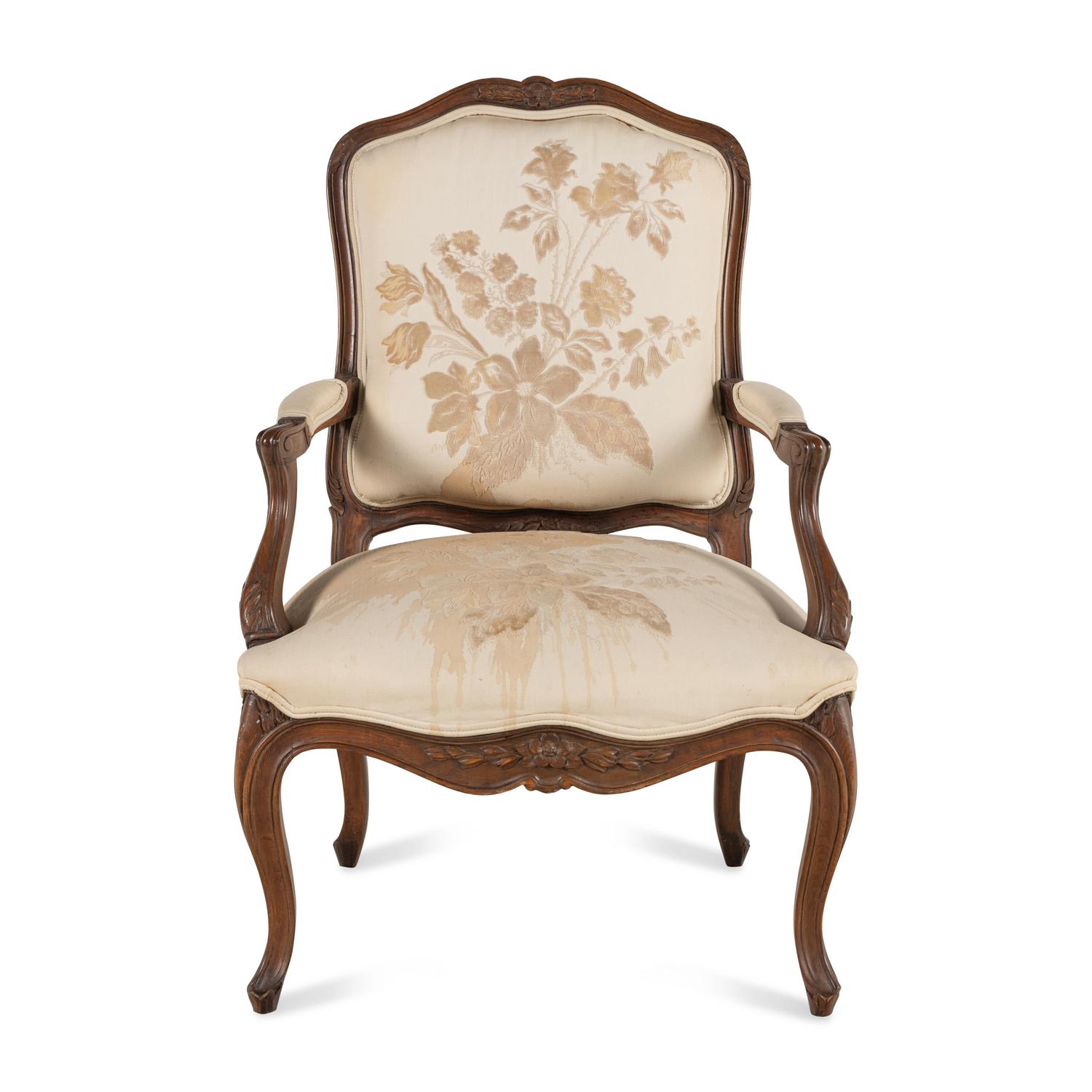A Louis XV Style Carved Walnut Fauteuil