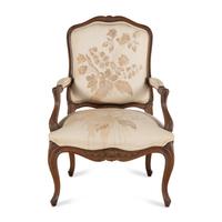 A Louis XV Style Carved Walnut Fauteuil