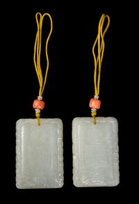 A Pair of White Jade 'Dragon and Phoenix' Plaques Length of each 2 1/4 inches. — 19TH CENTURY