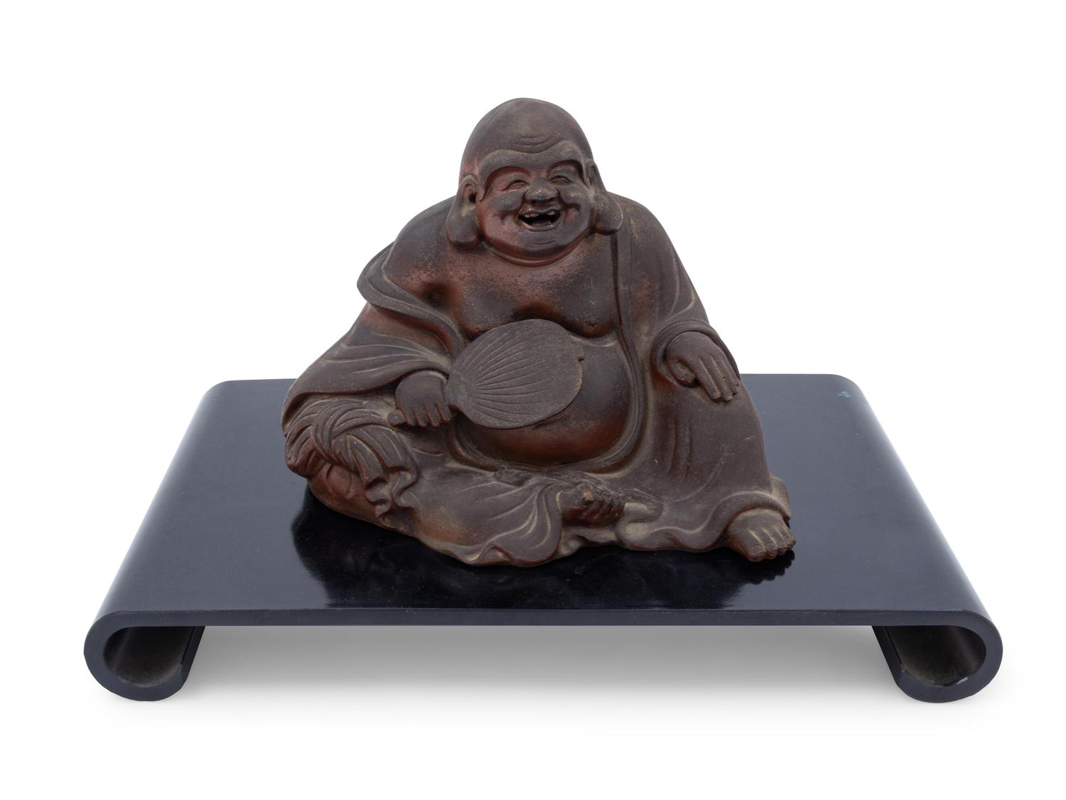 A Chinese Pottery Figure of a Laughing Buddha