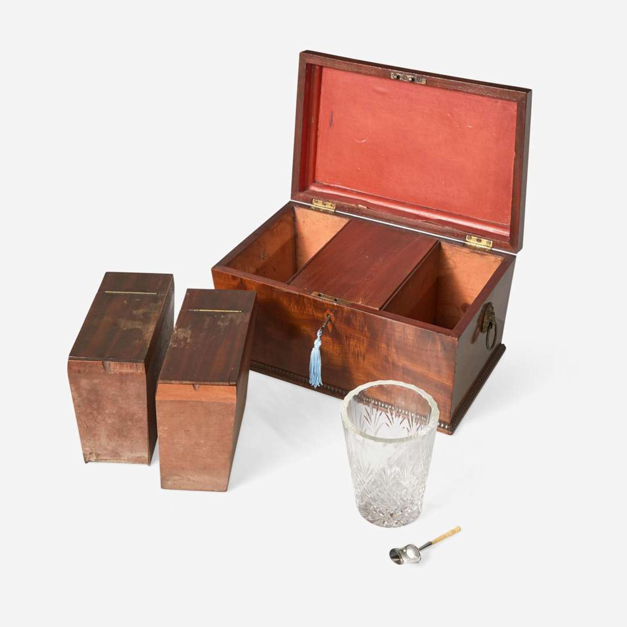 A Classical carved mahogany work table together with Regency mahogany tea caddy The table probably Baltimore, MD, circa 1820-1830