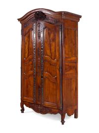 A Louis XV Provincial Carved Walnut Armoire