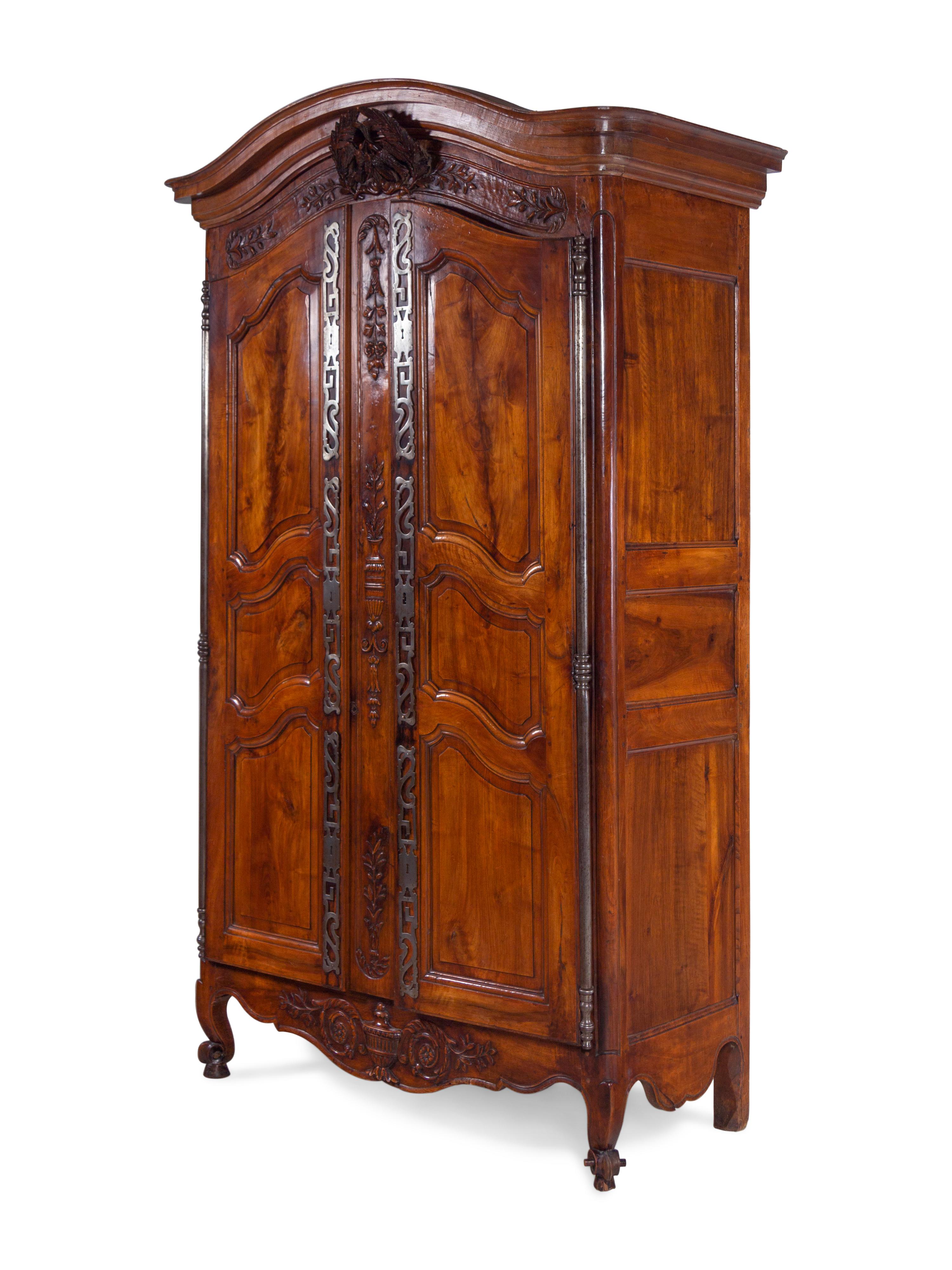 A Louis XV Provincial Carved Walnut Armoire