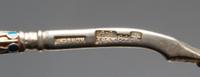 A Russian Silver-Gilt and Enamel Spoon, Mark of Gustav Klingert, assay mark of Anatoly Artsybashev, Moscow, 1893, the underside of the