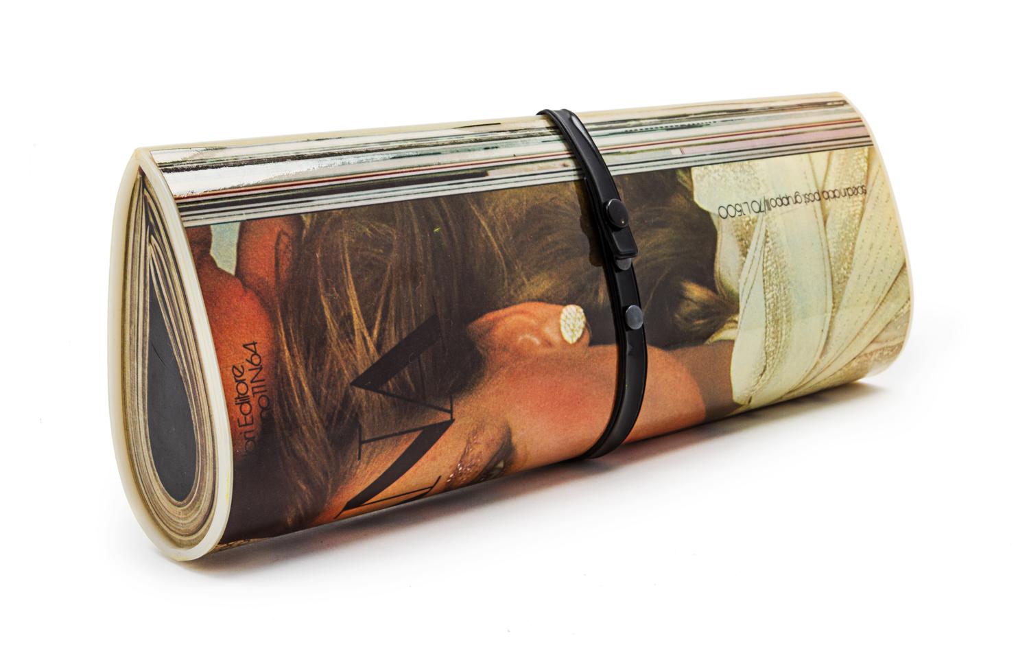 A Magazine Clutch, 12 1/2 x 5 x 2 inches.