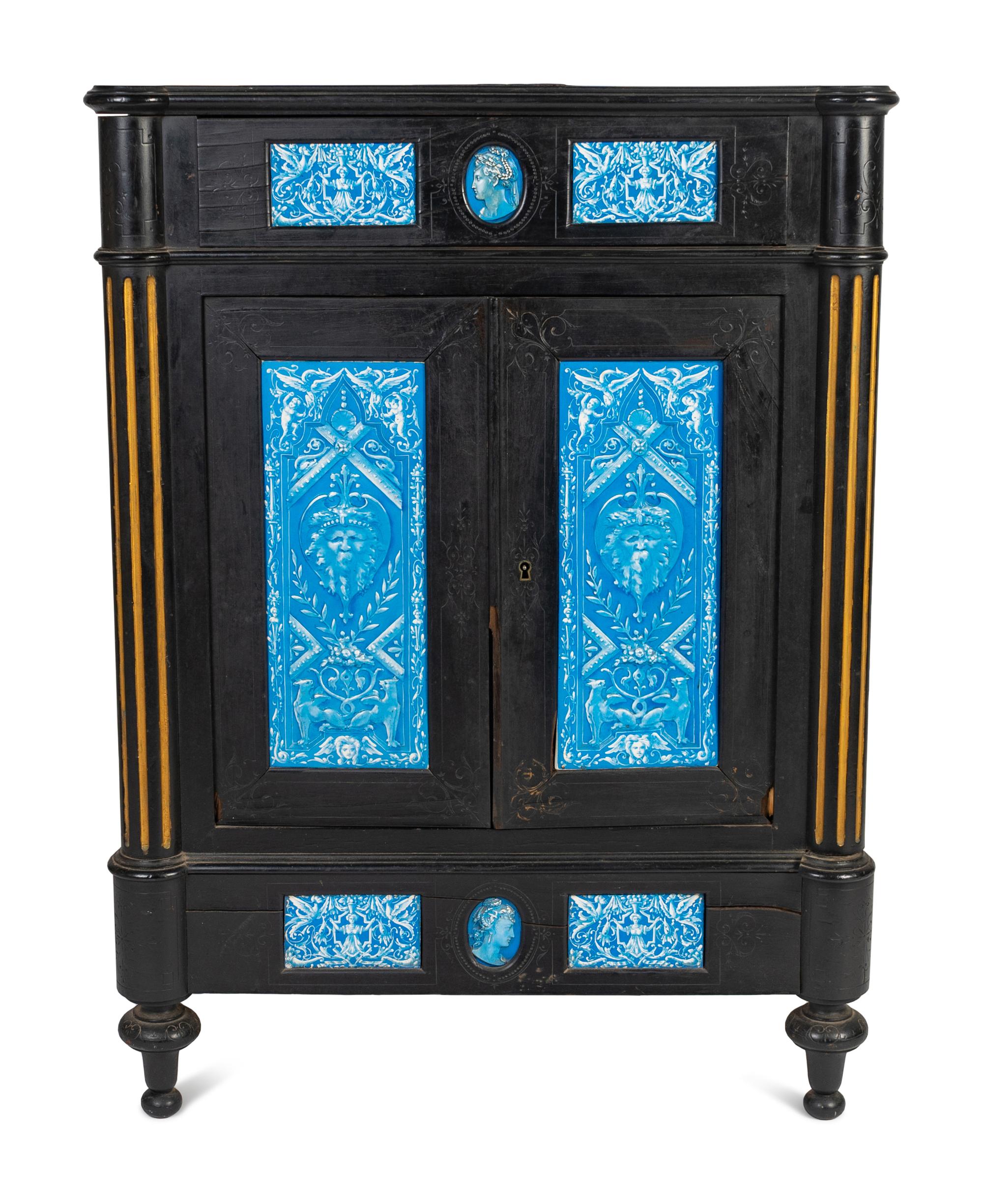 A Continental Blue Faience-Mounted Ebonized Cabinet