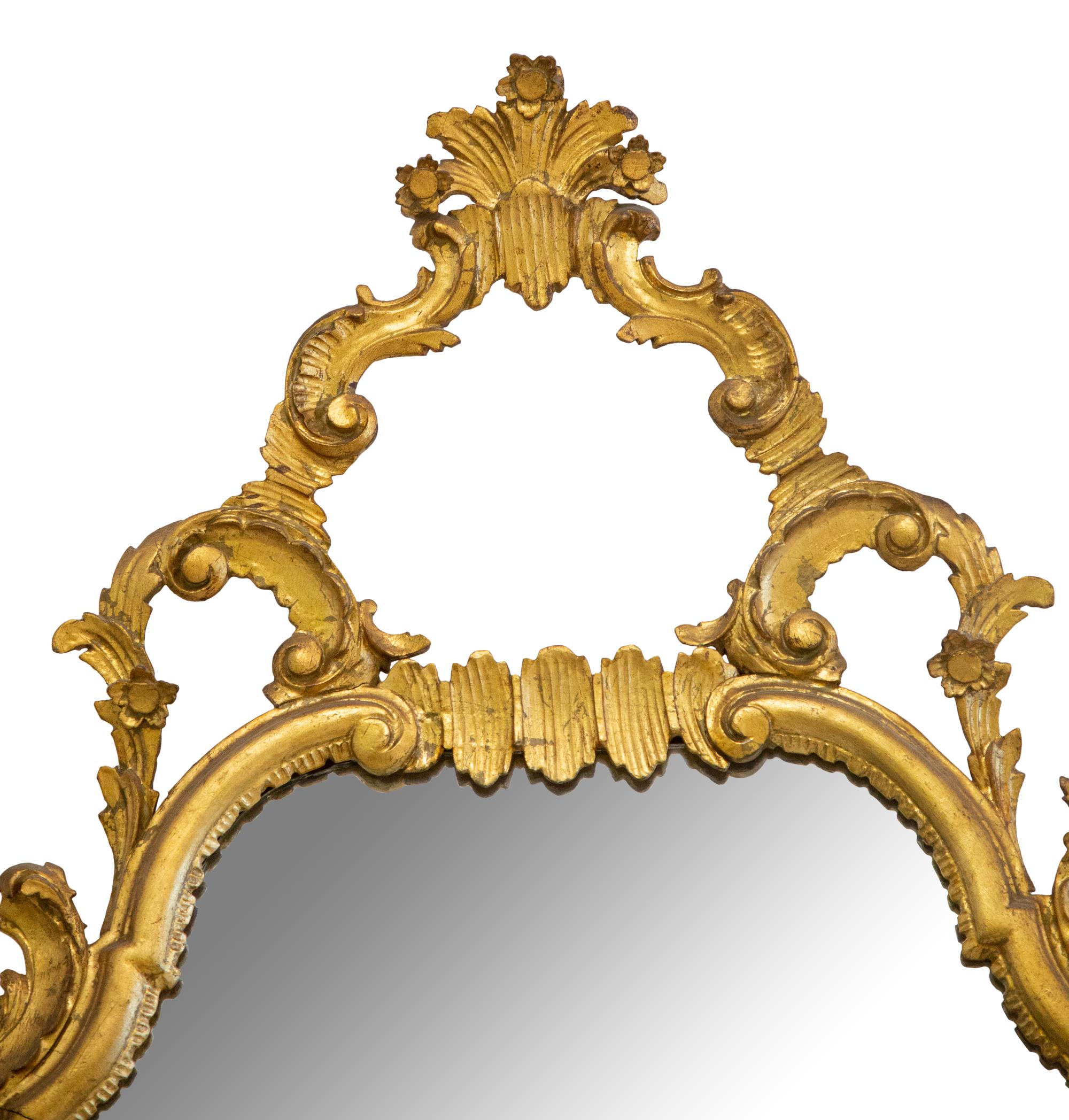 A Louis XV Style Carved Giltwood Mirror