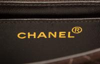 A Chanel Brown Suede Quilted Mini Flap Bag, 6.5" x 5" x 2.5".