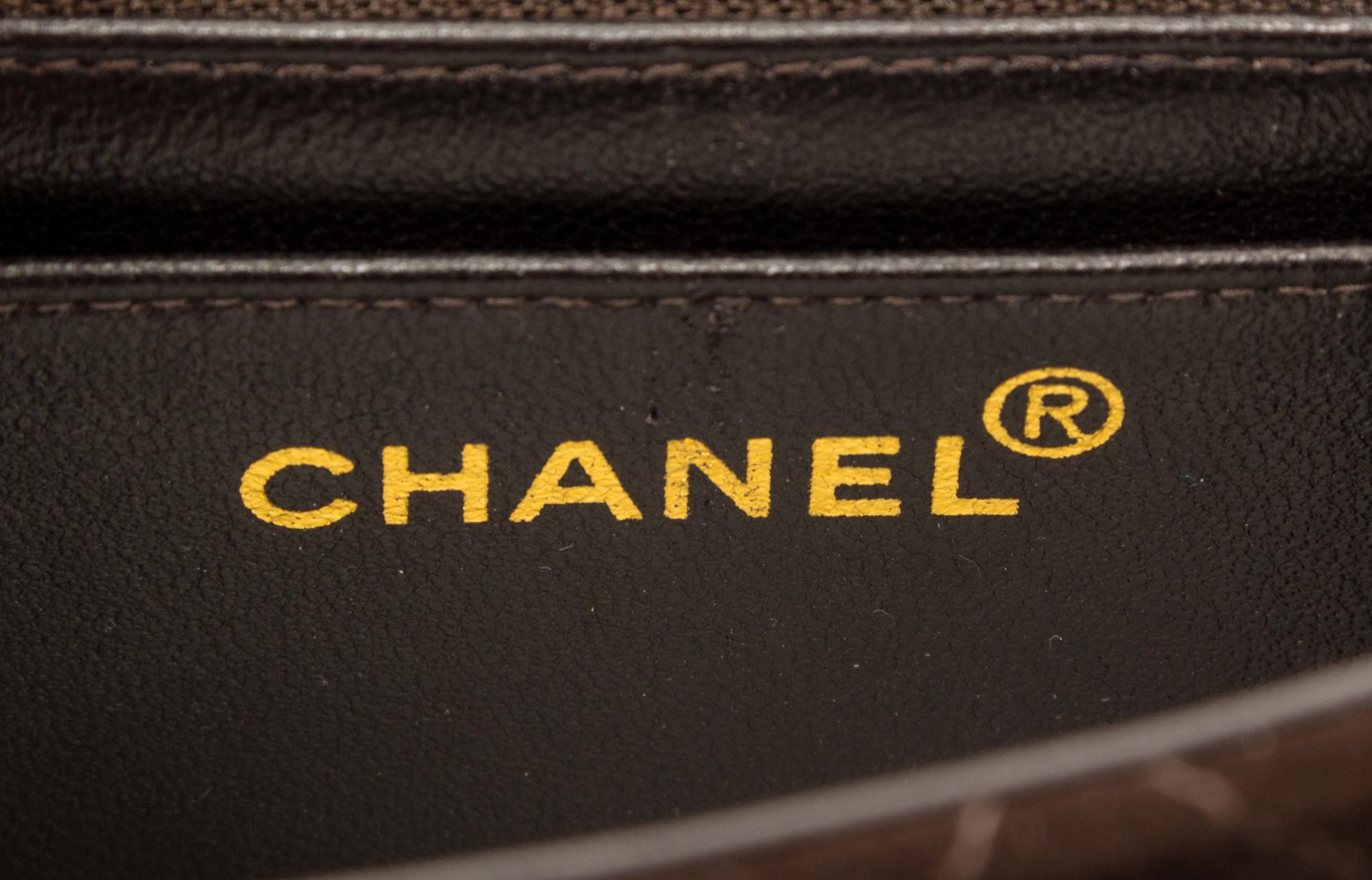 A Chanel Brown Suede Quilted Mini Flap Bag, 6.5" x 5" x 2.5".