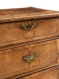 A George II Walnut Chest of Drawers