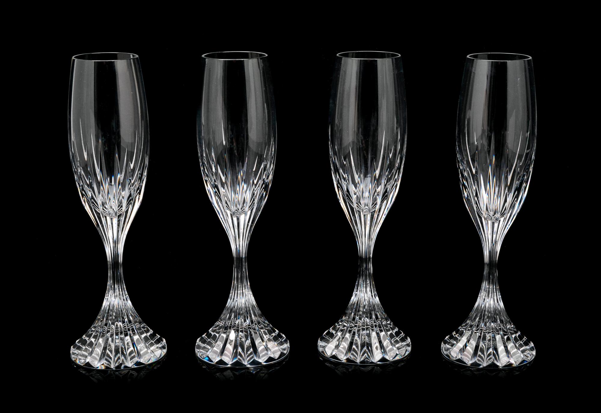 A Set of Twelve Baccarat Champagne Glasses Height 8 1/2 inches.