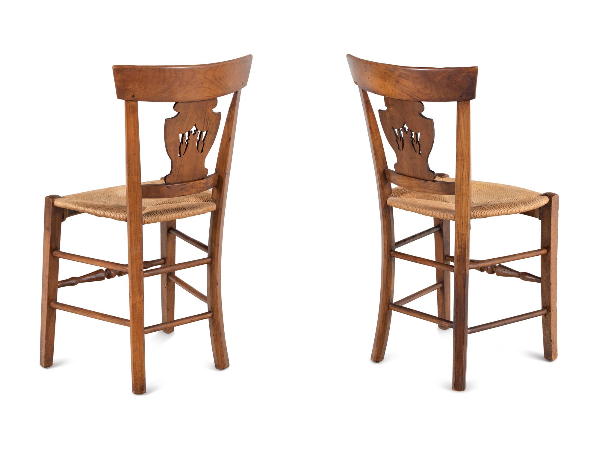 A Pair of Directoire Carved Walnut Rush-Seat Side Chairs