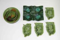 A Collection of Thirteen Haeger Pottery Ash Receivers Width of widest 13 1/4 inches.