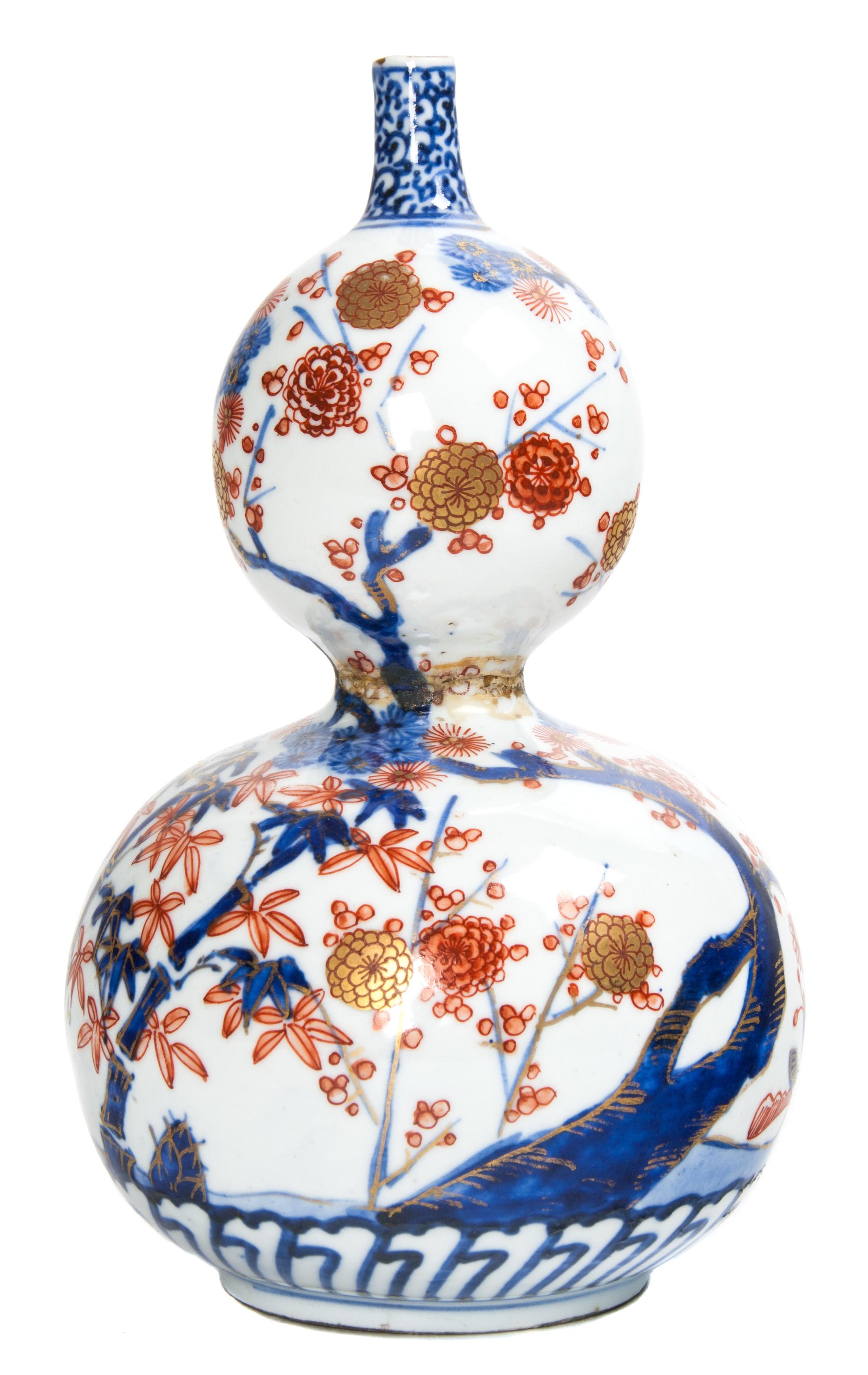 A Japanese Meiji Porcelain Vase Height 8 1/4 inches.
