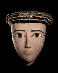 An Egyptian Wood and Painted Cartonnage Mummy Mask