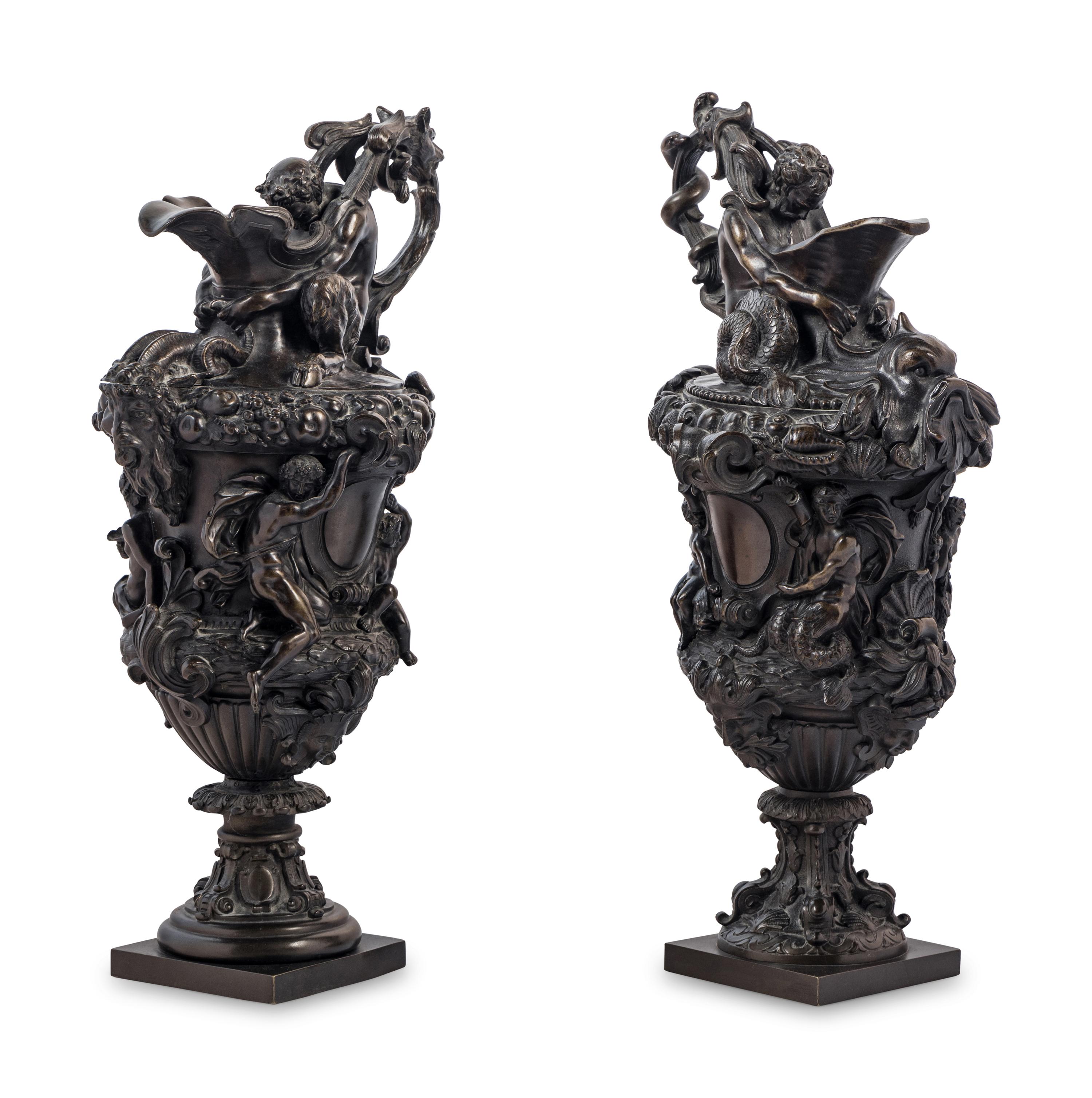 A Pair of Grand Tour Bronze Ewers Emblematic of Water and Earth