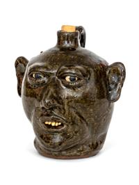 A Lanier Meaders Glazed Pottery Grotesque Face Jug
