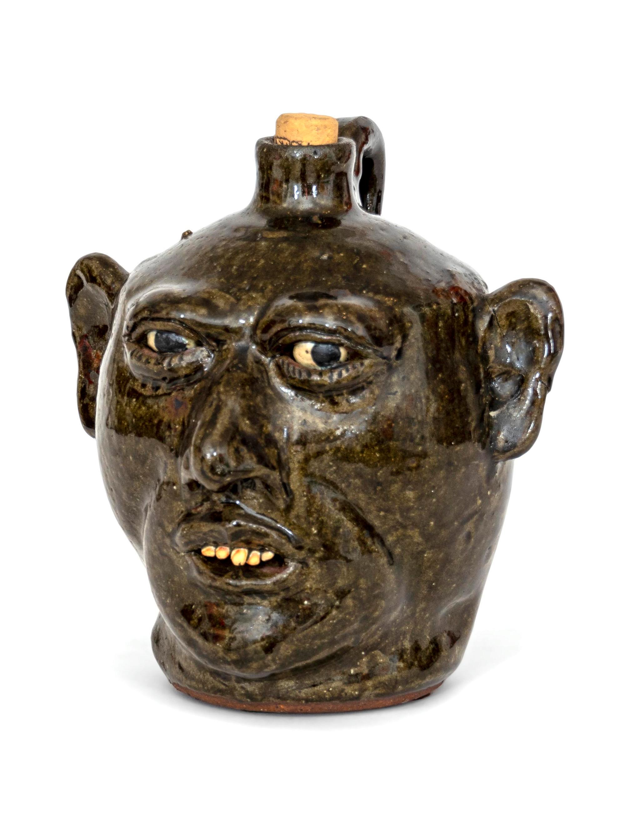 A Lanier Meaders Glazed Pottery Grotesque Face Jug