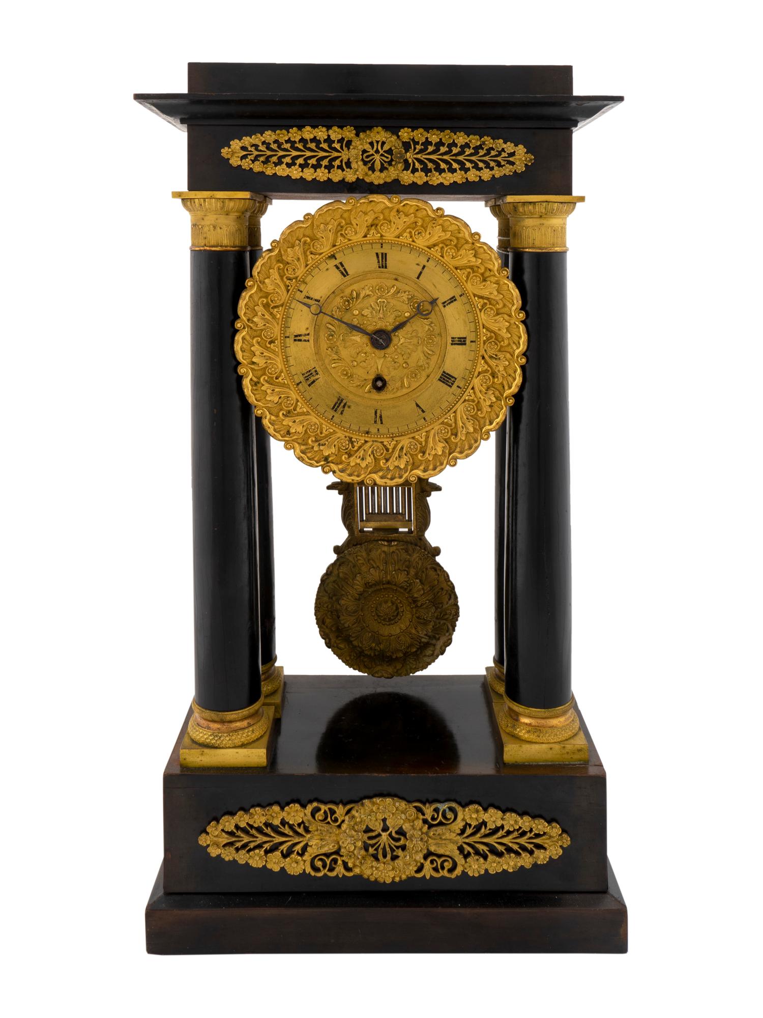 A French Empire Style Ebonized Wood and Gilt Portico Clock — BEAUPRE, EARLY 20TH CENTURY