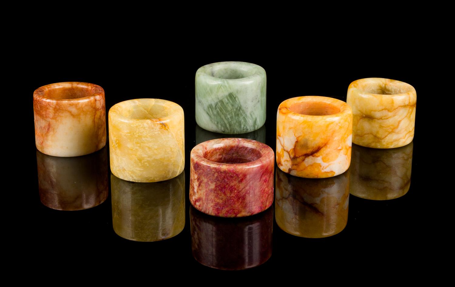 Six Chinese Hardstone Archer's Rings Diameter of largest 1 3/8 inches.