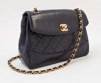 A Chanel Navy Lambskin Flap Shoulder Bag, 9.5" x 6.5" x 3"; Strap drop: 21".