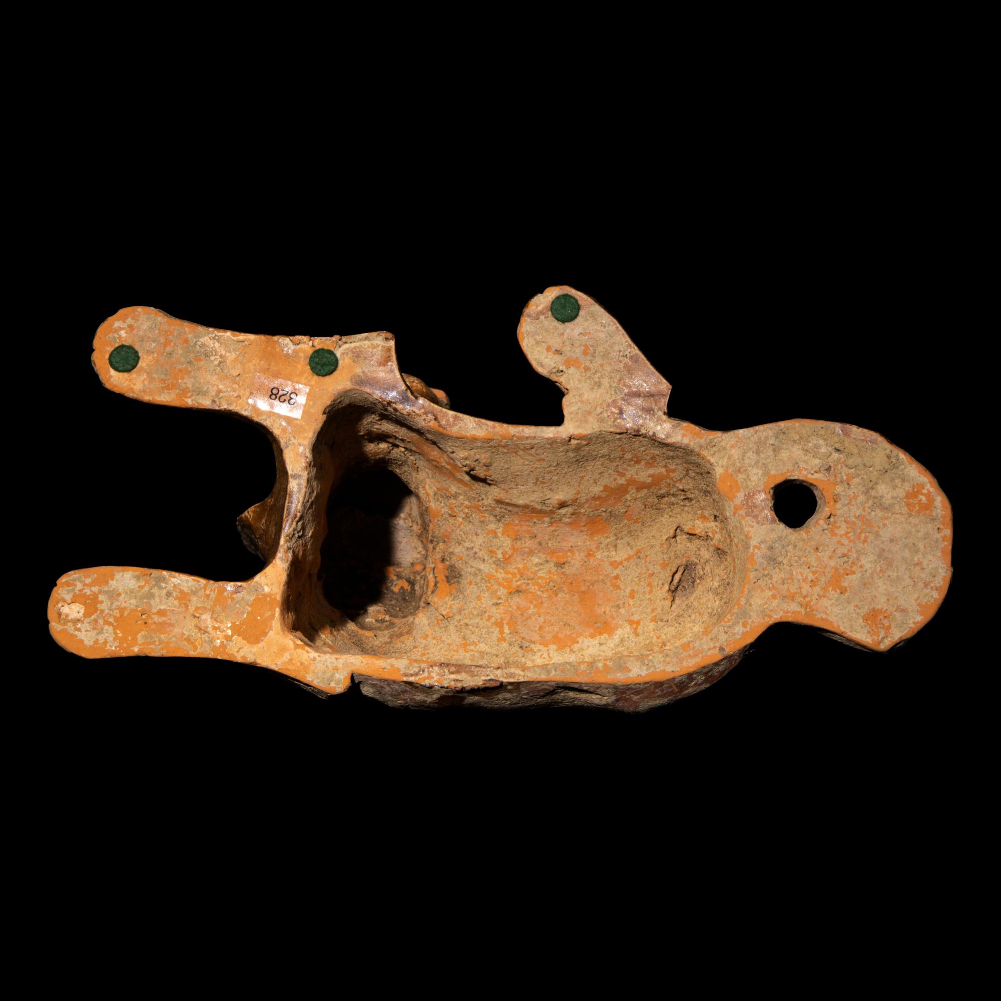 A Chinese Straw Glazed Pottery Figure of a Recumbent Dog, Han Dynasty 漢 陶臥犬