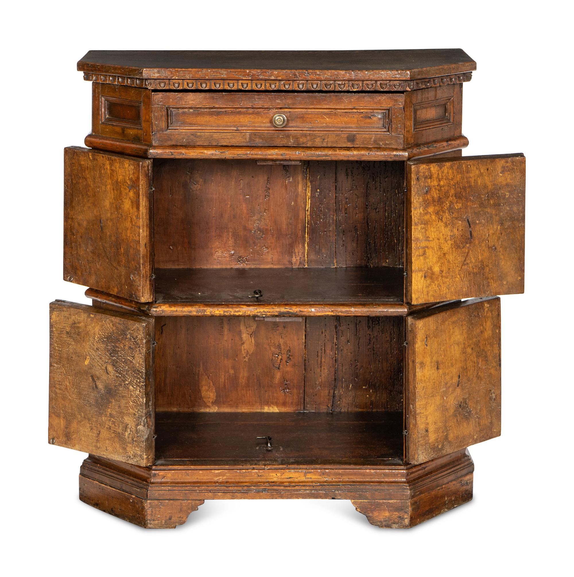 An Italian Baroque Carved Walnut Cabinet