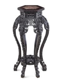 A Chinese Carved Hardwood and Marble-Inset Pedestal Table