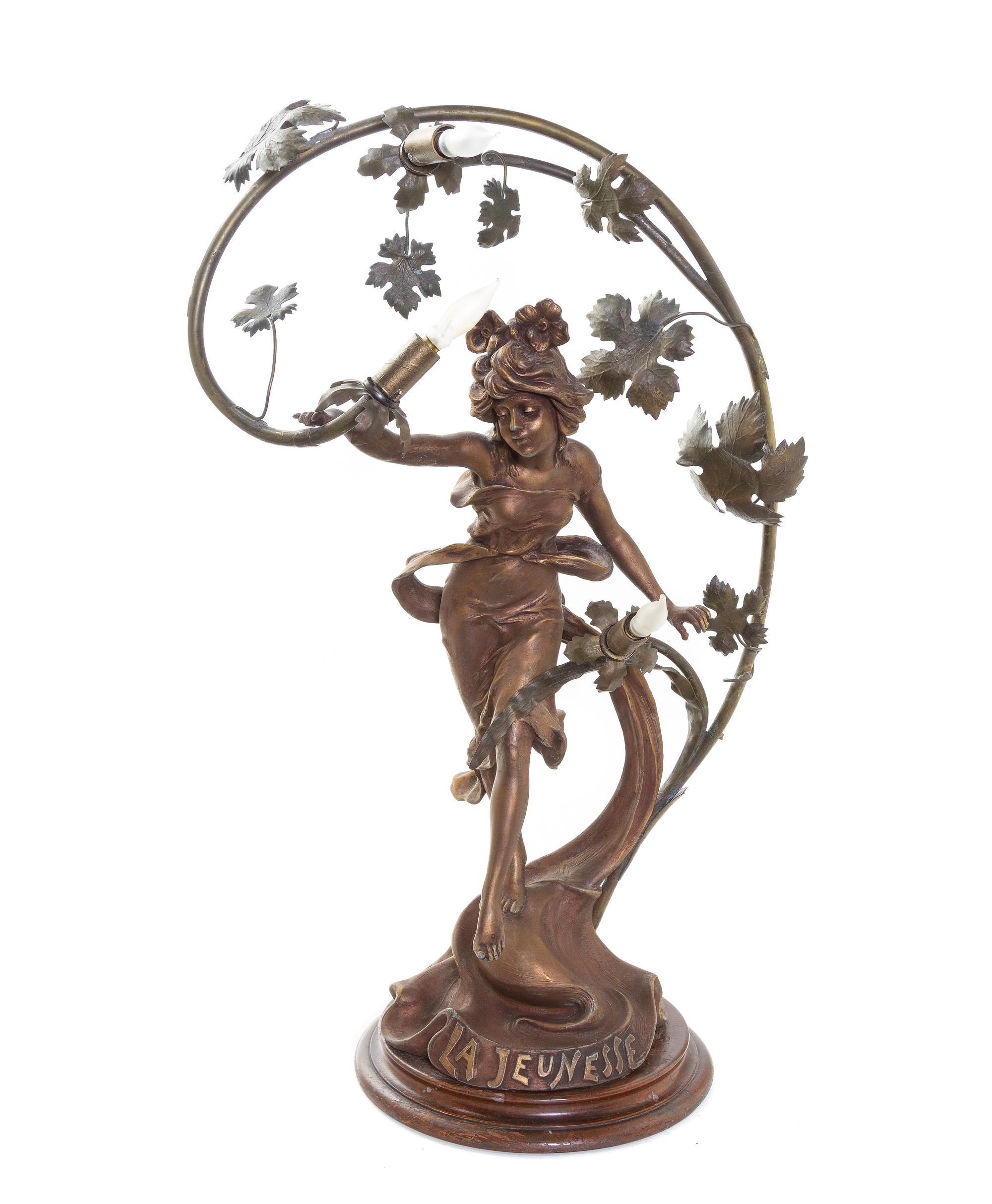 An Art Nouveau Cast Metal Three-Light Newel Post Lamp, Height 27 1/2 inches.