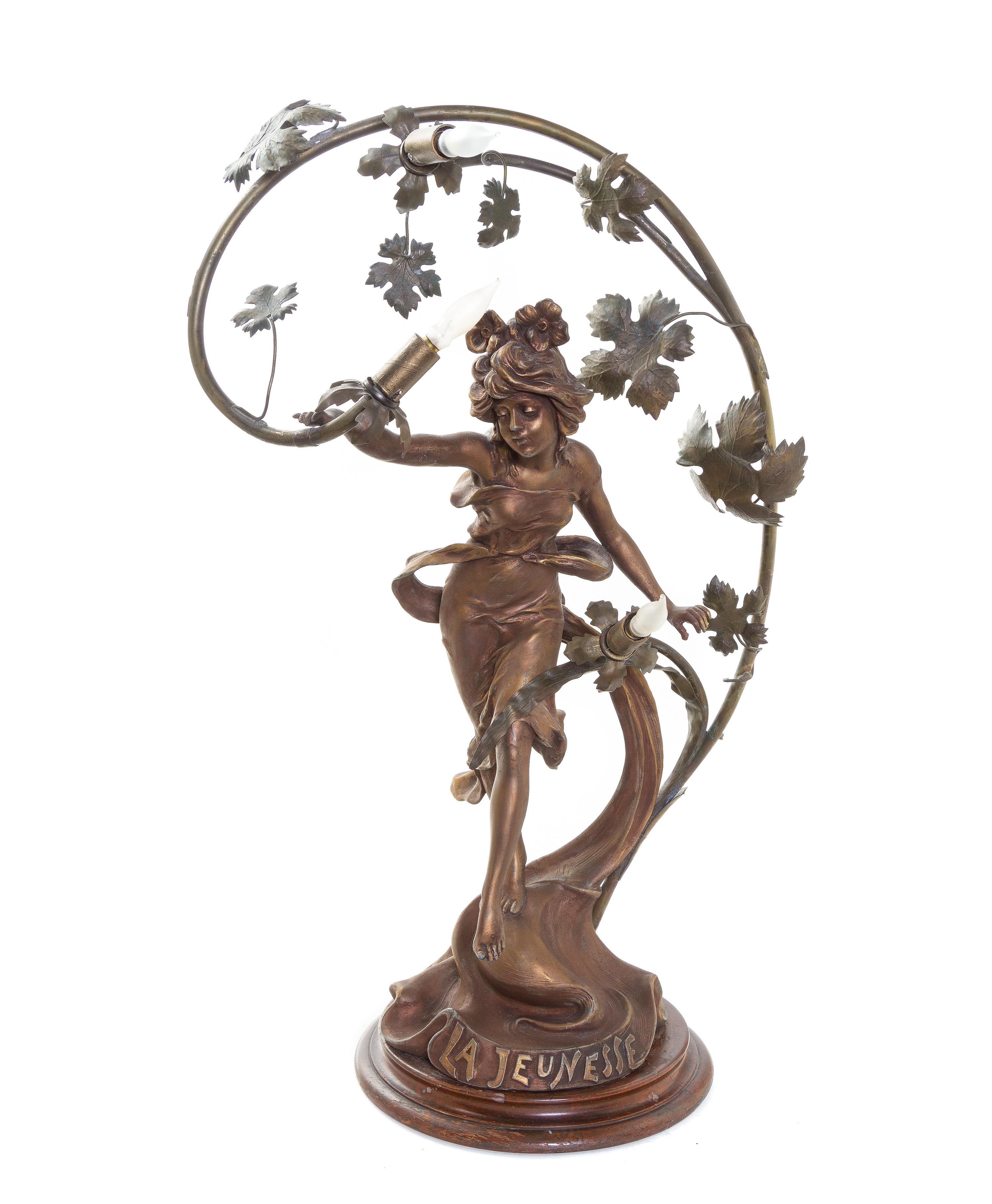 An Art Nouveau Cast Metal Three-Light Newel Post Lamp, Height 27 1/2 inches.