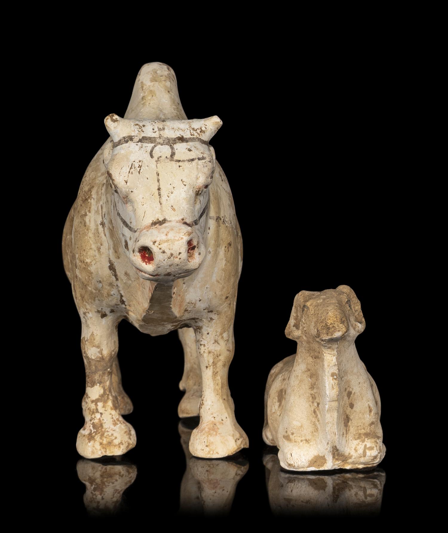 A Chinese Painted Pottery Figures of an Ox and a Ram