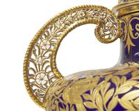 A Royal Crown Derby Parcel Gilt Twin-Handled Vase and Cover