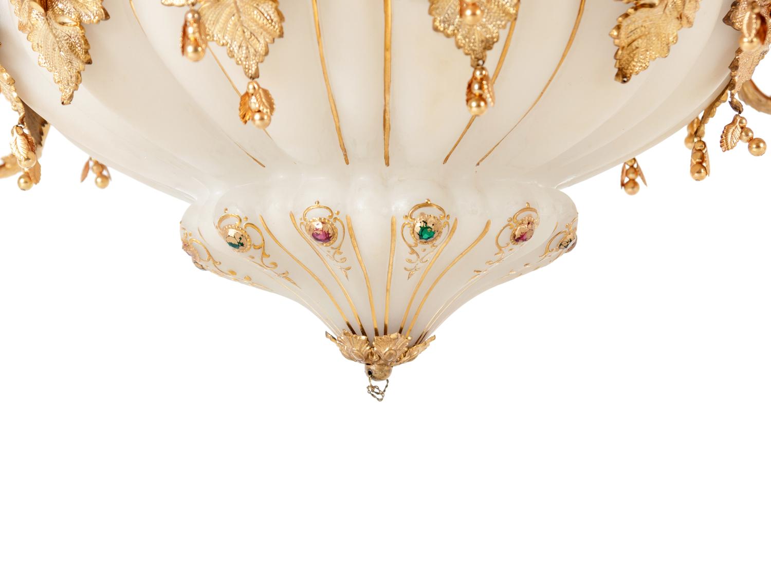 A Continental Gilt Metal and Jeweled Opaline Glass Twelve-Light Chandelier