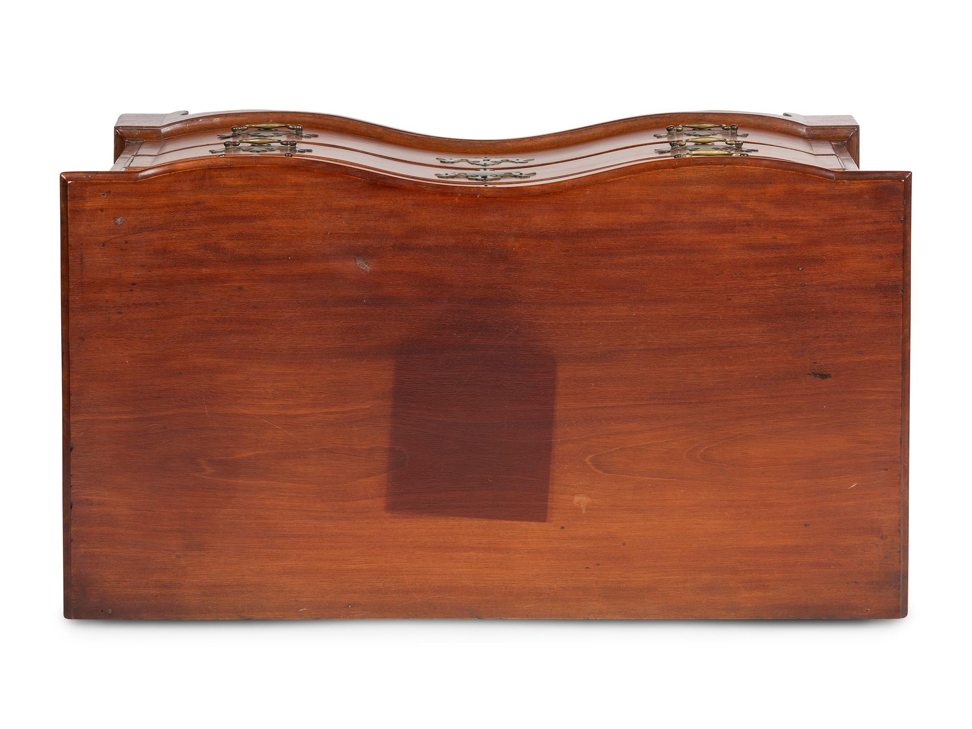 A Chippendale Carved Mahogany Reverse Serpentine Chest of Drawers, 18th Century
