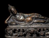 A Tibetan Bronze Figure of a Reclining Buddha