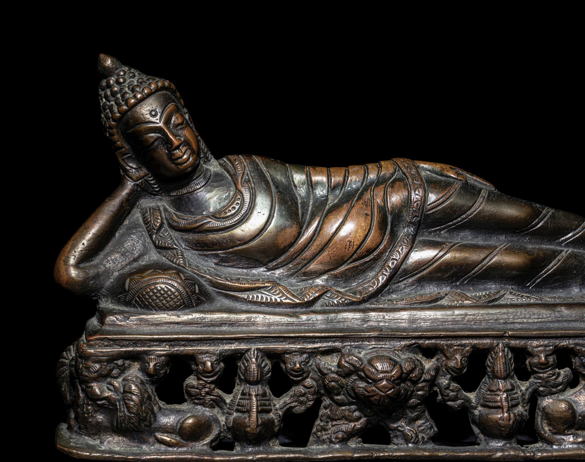 A Tibetan Bronze Figure of a Reclining Buddha