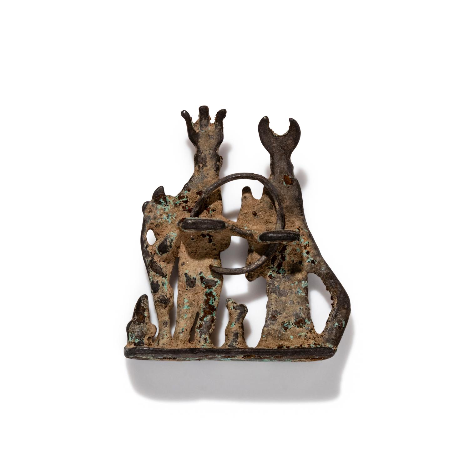An Egyptian Silver Pendant with the Gods Isis and Harpocrates