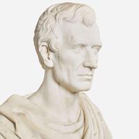 A carved Carrara marble bust of a Classically draped gentleman 19th century