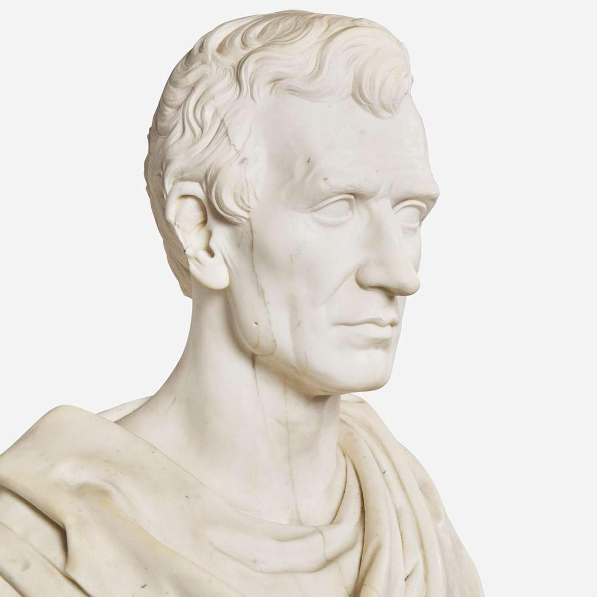 A carved Carrara marble bust of a Classically draped gentleman 19th century