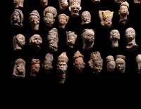 A Group of 65 Gandharan Terracotta Heads