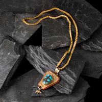 Herbert Taylor (Diné, 1951-1996) — 14K Gold Bisbee Turquoise, and Mediterranean Coral Pendant, with 22K Gold Chain