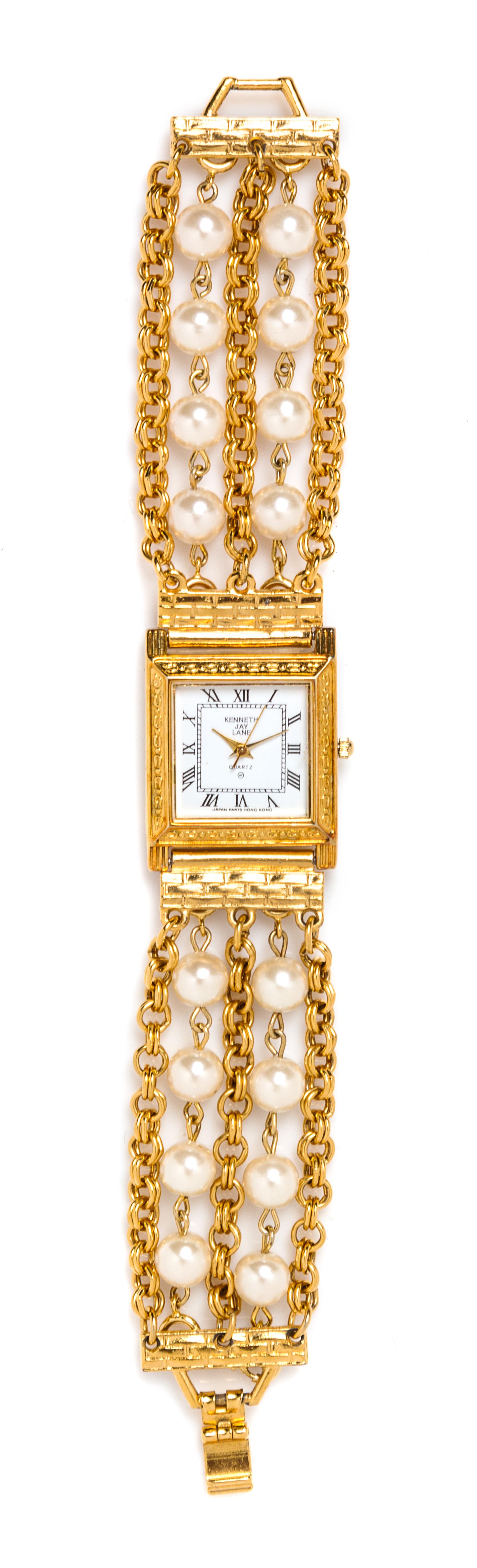 A Kenneth Jay Lane Faux Pearl and Goldtone Watch, 7" x 1".