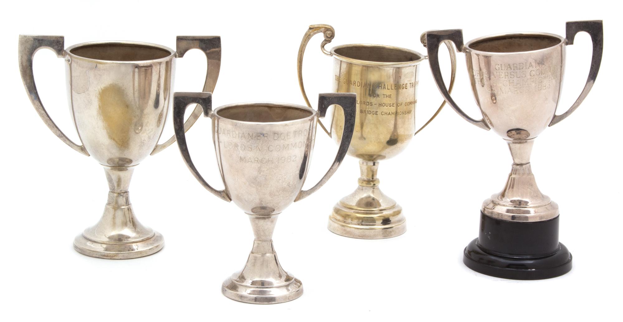 A Group of Four Diminutive Silver Plate Trophy Cups Height of tallest 5 3/4 inches. — 20TH CENTURY