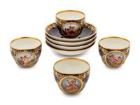 A Set of Four Berlin (K.P.M.) Parcel Gilt Cobalt Ground Porcelain Teacups and Saucers