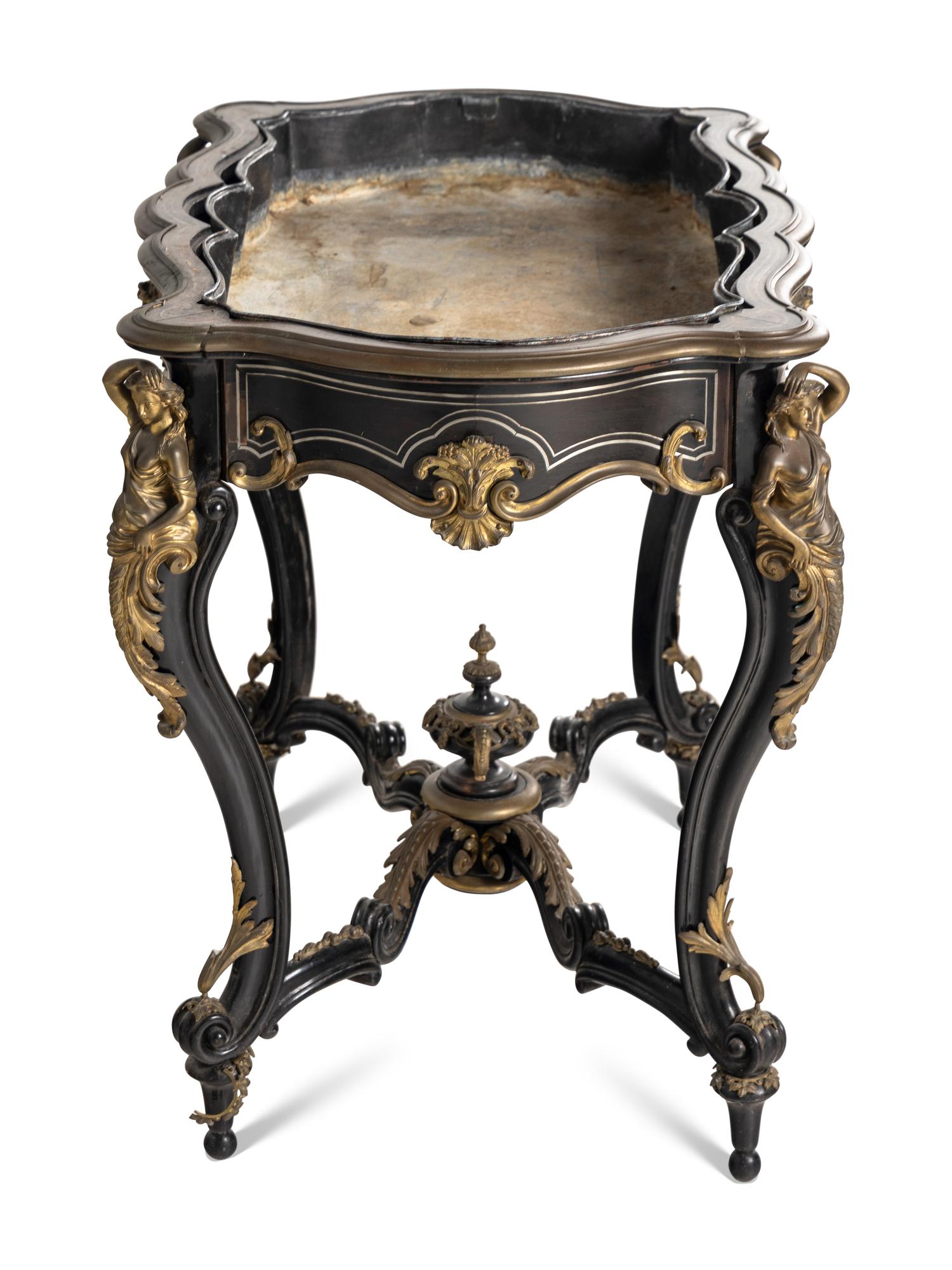 A Napoleon III Gilt Bronze Mounted Ebonized Jardinière Table