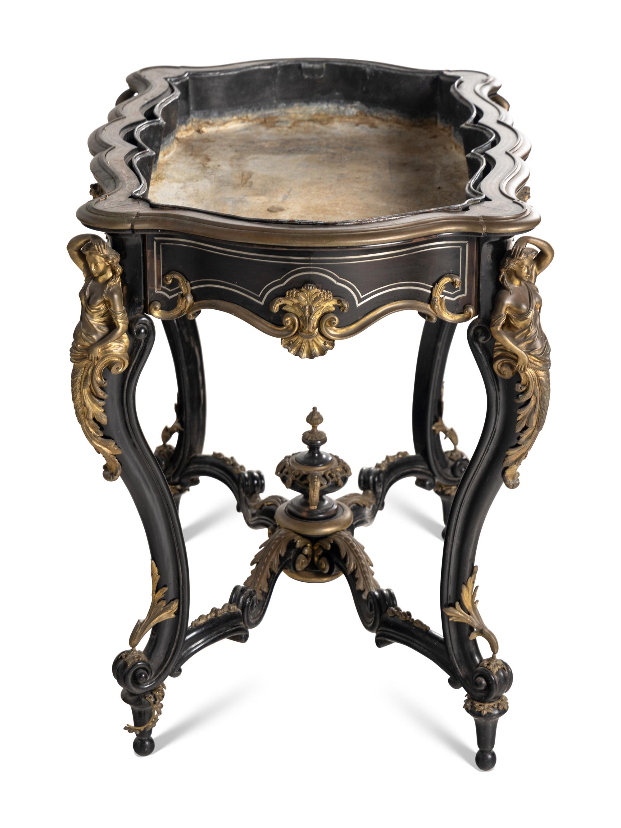 A Napoleon III Gilt Bronze Mounted Ebonized Jardinière Table