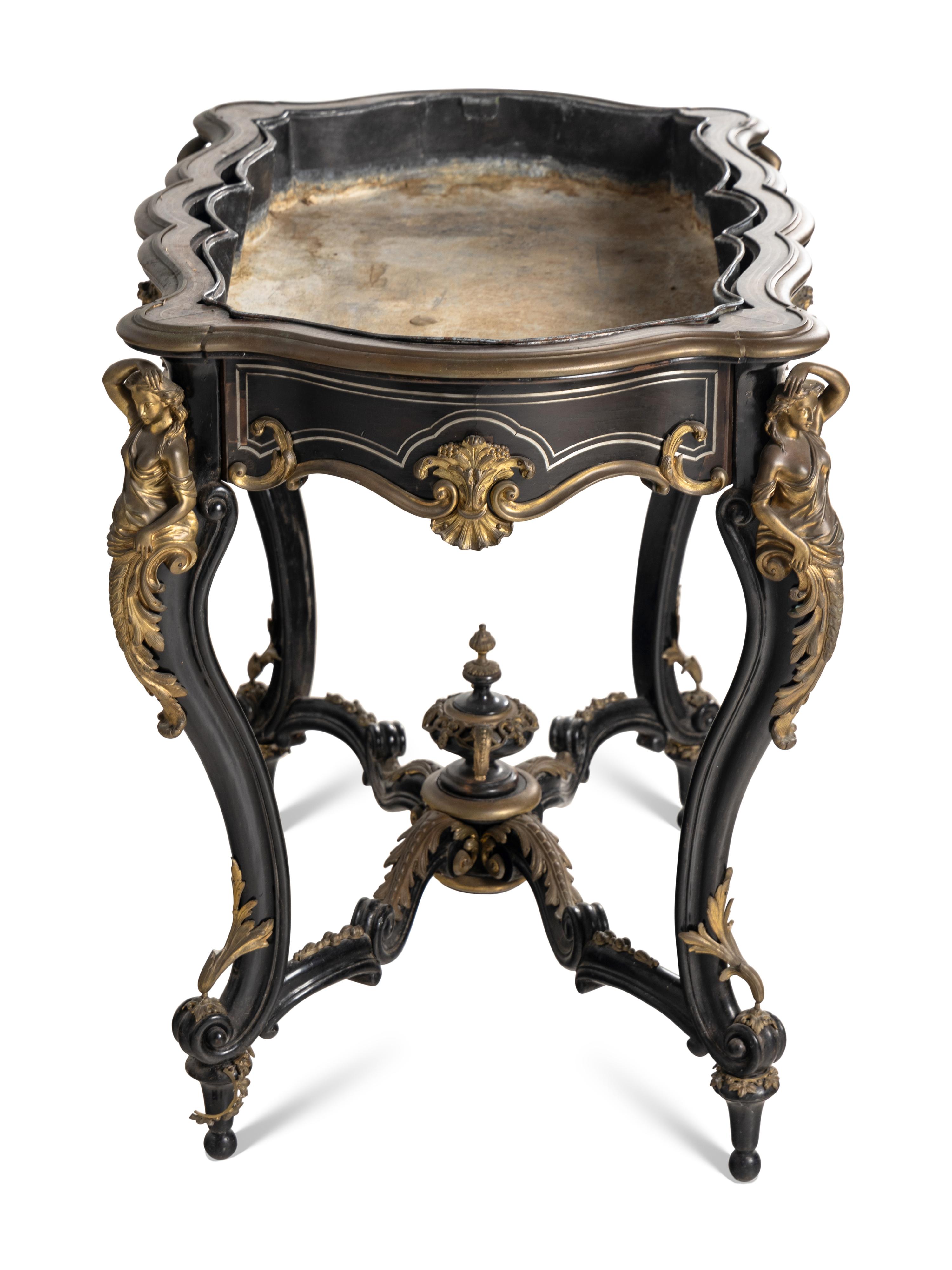 A Napoleon III Gilt Bronze Mounted Ebonized Jardinière Table