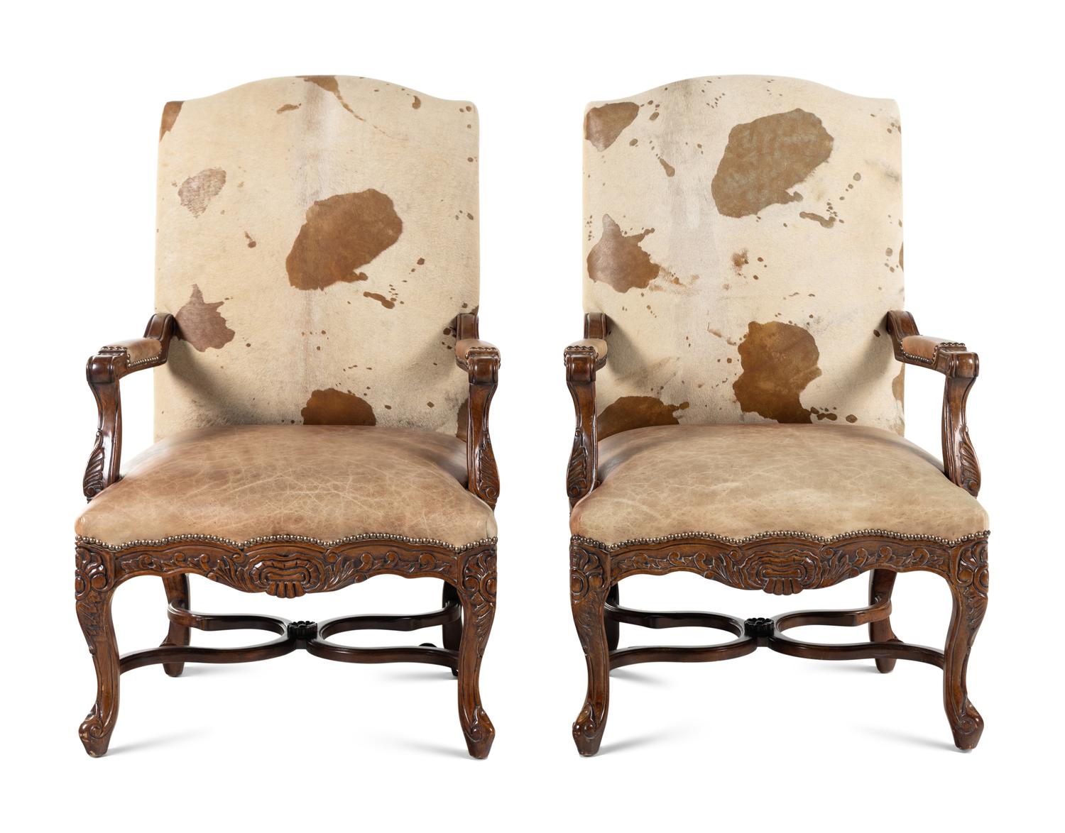 A Pair of Louis XV Style Carved Walnut Fauteuils